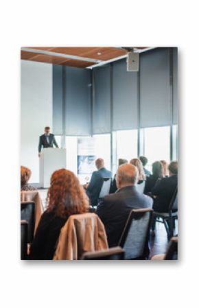 Speaker giving a talk in conference hall at business event. Rear view of unrecognizable people in audience at the conference hall. Business and entrepreneurship concept