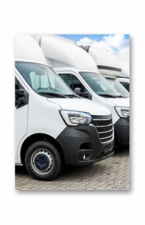 Fleet new modern electric hybrid hydrogen or diesel white vans parked in line row outdoors. Cargo freight industrial courier transportation logistics service. Commercial vehicle maintenance insurance