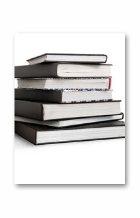 A front side on view of a pile of seven study books, textbooks, on a table isolated against a transparent background