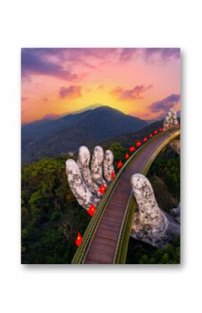 Aerial view Golden bridge at sunset in ba na hills two hands, Da nang Vietnam
