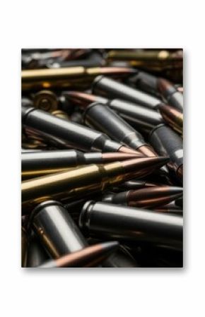 Close up of a large jumbled pile of silver and gold rifle ammunition cartridges