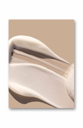 creamy texture of cosmetic samples on a pastel beige background