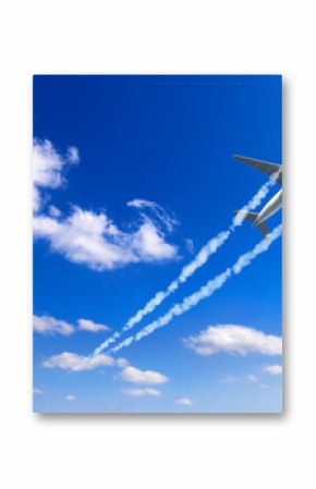 Horizontal nature background with aircraft and Jet trailing smoke in sky. Airplane and condensation trail. Foggy jet trail and plane in blue sky with white clouds. Traveling the world concept