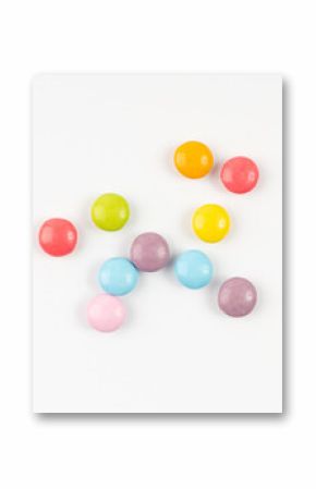 Scattered small candies isolated. Colorful dragees, multicolored glazed chocolate buttons