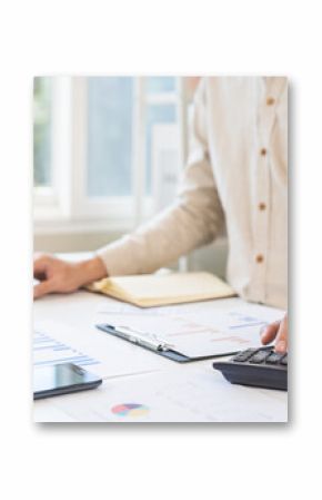 Account finance, asian young business man hand using calculator, laptop computer for calculate budget, cost and income of company from paperwork, plan spend money expenses, working on desk at home.
