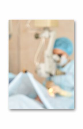 Medical team performing surgery in hospital operating room with advanced equipment and technology