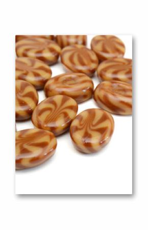 Caramel candies isolated on white background