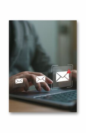 Businessman checking email notifications on laptop with alert icon, representing digital communication, work messages, productivity and online correspondence in the workplace.