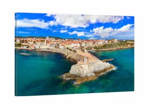 Italy , Tuscany tourism scenic places and coastal towns - charming Piombino in Livorno province. aerial drone panoramic view with lighthouse and old town