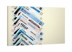 Big amount of driving licenses from various USA states. Stack of driving license specimen cards