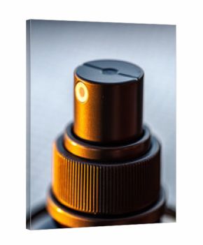 Macro Close-up of Cosmetic Spray Bottle Nozzle and Mechanism