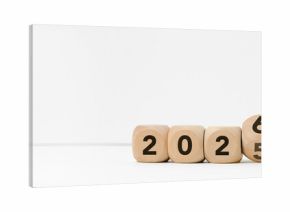 Wooden blocks transitioning from 2025 to 2026 on a clean white background. Concepts of a new year beginning, goal setting, planning, transition, change, and future opportunities.