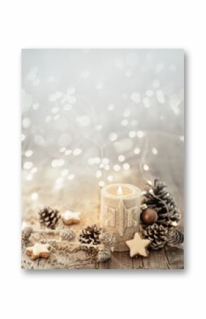 White Christmas candle on rustic wooden boards - Decoration with natural elements, twigs, pine cones and cookies - Advent background with copy space