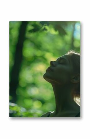 Profile of a relaxed woman breathing fresh air in a green forest