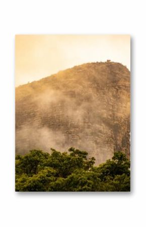 Dramatic mist-covered mountain peak.