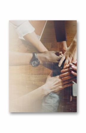 Hands joined over wooden table