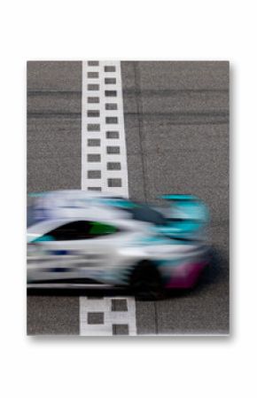 Motion blurred super car crossing finish line checkered on race track circuit, Race super car blurred motion crossing finish checkered line on race track, concept win and goal reached.