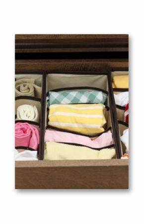 Organizers with folded clothes in drawer indoors, closeup