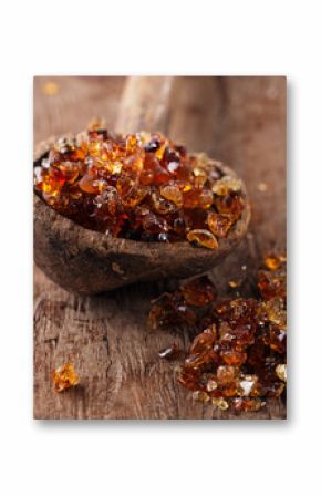 Gum arabic, also known as acacia gum - in  old wooden spoon