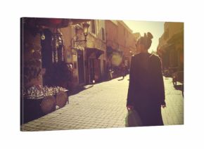 Young woman shopping in the Marrakech Medina at sunset