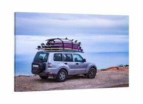 Surfboards mounted on the roof of the car. photo travel. Leisure  