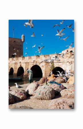 Fishing boats, gear and catch on background of Castelo Real of M