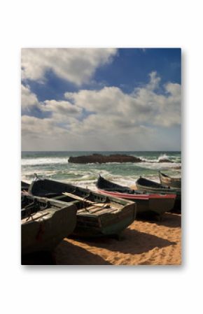 Morocco. Oualidia. Atlantic Coast and fish boats on the beach