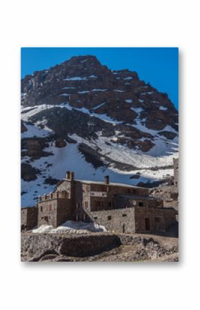 Toubkal national park in springtime with mount, cover by snow and ice, Refuge Toubkal, start point for hike to Jebel Toubkal, – highest peak of Atlas mountains and Morocco