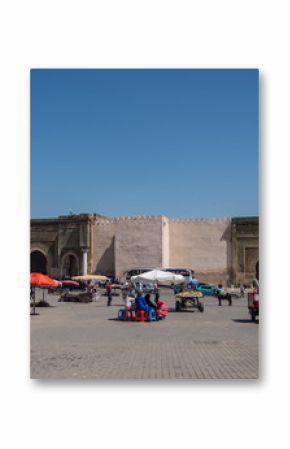  Lahdim Square of medieval imperial city of Meknes with Bab el Mansour gate at background, Morocco.