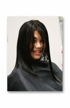 Young teen girl getting ready for a haircut