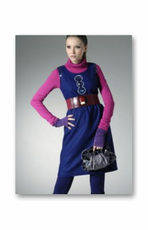 Fashion girl holding hand bag on light background