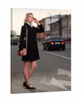 Young woman hailing a taxi cab