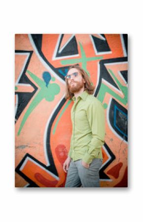 stylish hipster model with long red hair and beard lifestyle