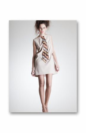 cute woman dressed in elegant retro clothes on grey background