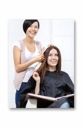 Beautician tries lock of dyed blond hair on the client 