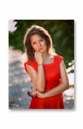 Portrait of a beautiful sexy fashion girl in a red dress 