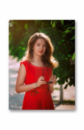 Portrait of a beautiful sexy fashion girl in a red dress 