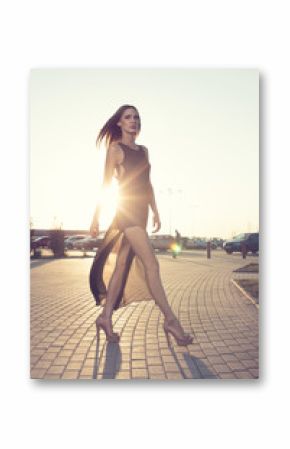 Walking woman in long black dress