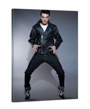 Retro rock and roll 50s fashion man with dark grease hair. Weari
