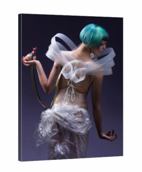 Young, thin, serious, pale girl with tirquoise blue-purple hair ,twisted arm and looking down ,  holding heart 