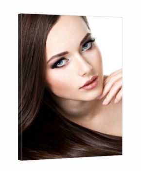 Portrait of beautiful young woman with long straight brown hair