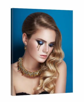 Beauty portrait of blonde hair Hollywood perfect curls style lady golden tear make-up