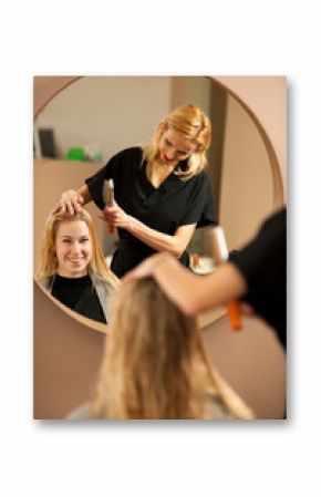 professional hair stylist at work - hairdresser  doing hairstyle