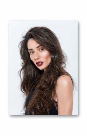 portrait of a young astonished brunette looking into camera