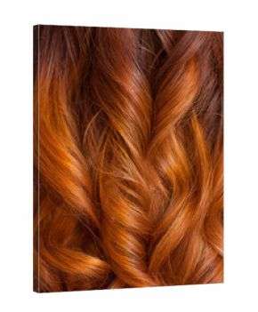Beautiful, healthy, long, curly, red hair close up.  Create curls with curling irons. Professional hair care.
