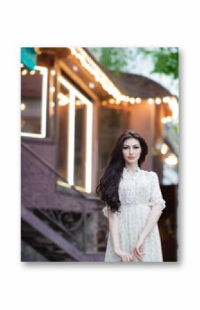 pretty caucasian girl with long hair in summer dress on background urban cafe location