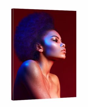 Beautiful dark-haired girl in profile on a claret background. Bright makeup and curvy hair in the style of "Afro". Color filters.