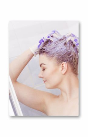Woman applying toner shampoo on her hair