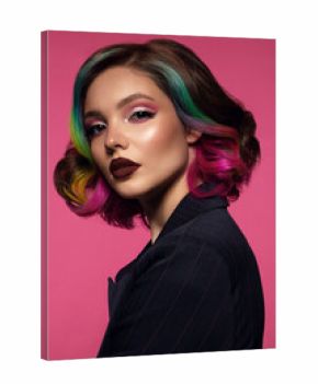 Beautiful woman with multi-colored hair and bright make up and hairstyle.