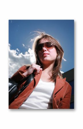 Portrait of a beautiful young woman in a city.
